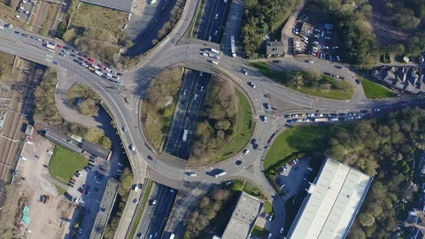 Overhead view of a busy roundabout in the midlands, motorway traffic Stock Footage 105510622