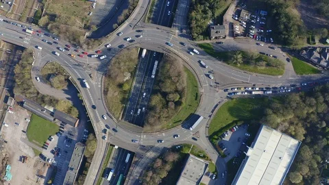Overhead view of a busy roundabout in the midlands, motorway traffic Stock Footage 105510700
