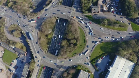 Overhead view of a busy roundabout in the midlands, motorway traffic Video stock 105510795