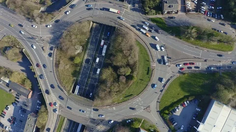 Overhead view of a busy roundabout in the midlands, motorway traffic Stock Footage 105510843