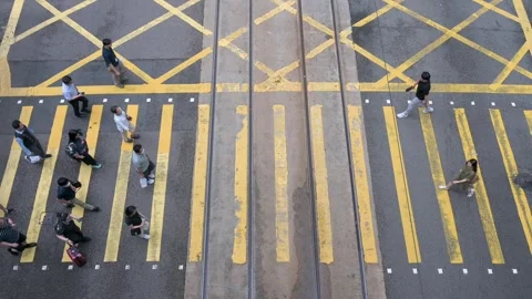 Overhead View of Busy Yellow-Painted Intersection with Zebra Crossing and Stock Footage 294661610