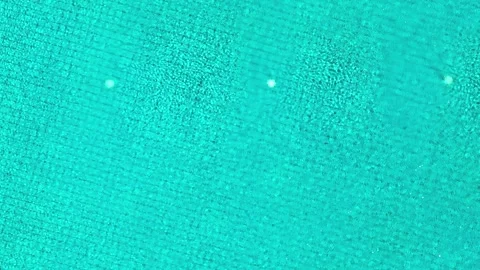 Overhead view of a calm, patterned turquoise pool surface. Stock Footage 307853841