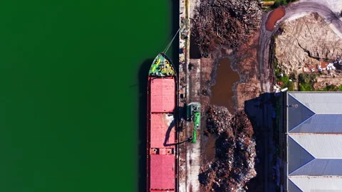 Overhead view of cargo ship deck beside scrap pile, port Stock Footage 343843865