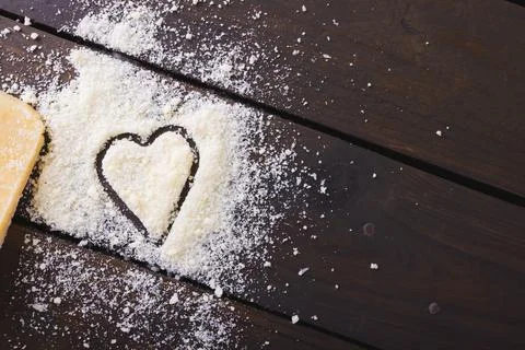 Overhead view of cheese with heart shape on wooden table, copy space Stock Photos