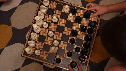 Overhead view of chessboard mid-game with pieces in play. Stock Footage 296199116