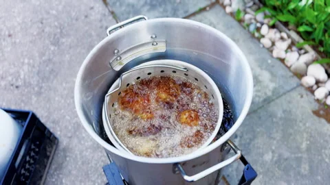 Overhead View Of Chicken Wings Deep Frying Outdoors Stock Footage 346648918