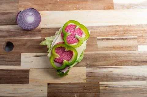 Overhead view of chopped onion on rustic board  food preparation background Stock Photos