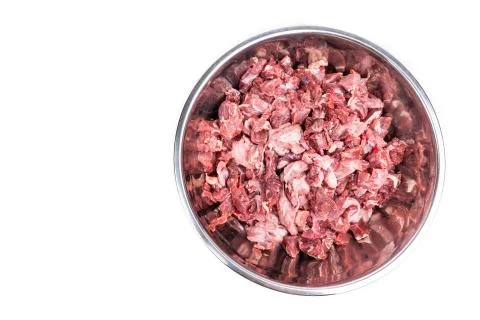 Overhead view on chunks of raw beef. Barf raw meat diet preparation for dogs Stock Photos