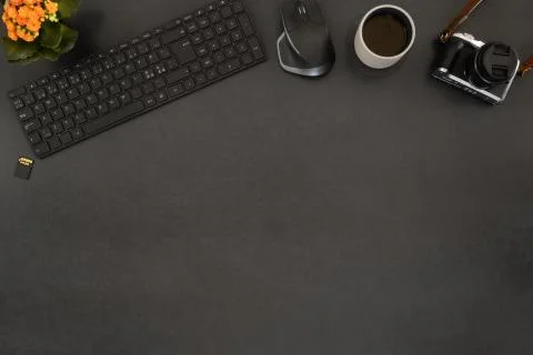 Overhead view of coffee and computer parts with camera on table Stock Photos