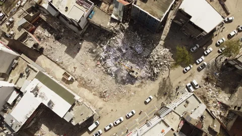 An overhead view of construction equipment working at a demolition site. Stock Footage 258103113