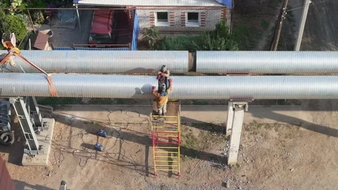 An overhead view of a construction site or street repair, with steam rising from Stock Footage 316671970