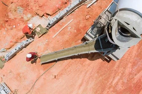 Overhead view of construction zone where fresh concrete is being applied to form Foto stock