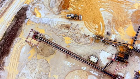 Overhead view of conveyor belt and wheel loader in sand quarry, Bulgaria Stock Footage 336725581
