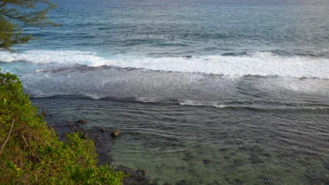 Overhead View of Crashing Ocean Waves Against a Clear Shallow Reef.Vivid footage Stock Footage 318008402