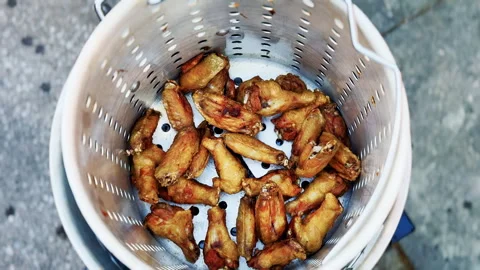 Overhead View Of Crispy Fried Chicken Wings Draining Stock Footage 346648995