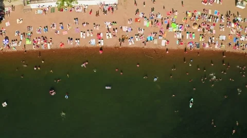 Overhead view of crowded sandy beach during sunny day 스톡 동영상 248719776