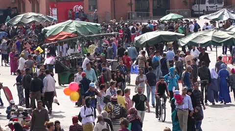 Overhead view of crowds passing through Jemaa El Fnaa in Marrakesh Morocco Stock Footage 62517481