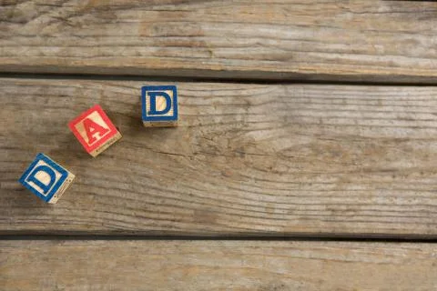 Overhead view of cube shapes with text dad on table Stock Photos
