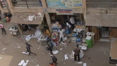 Overhead view of customers and workers around a busy printing hub 動画素材 326930880