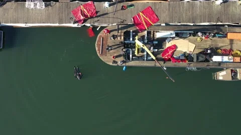 Overhead View Of Diver In Water Prior To Sunken Boat Recovery. 4K Stock Footage 152423373