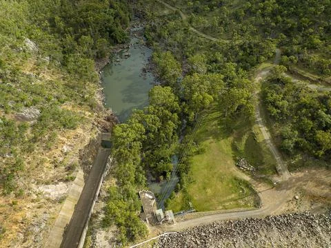 Overhead view down onto part of the dam wall and channel at Eungella Dam Stock Photos