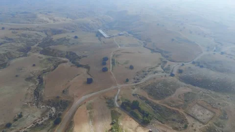 Overhead View of Dry Fields and Winding Rural Roads Stock Footage 348666989