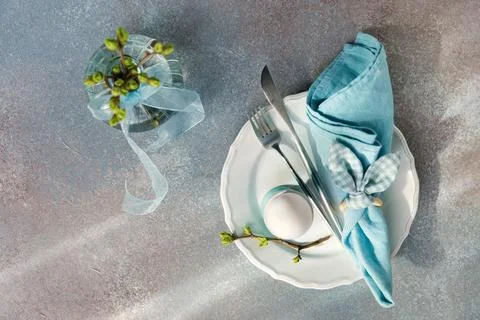 Overhead View of Easter Table with Egg and Branch Стоковые фото