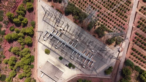 Overhead view of an electrical substation surrounded by Mediterranean scrubland 動画素材 345103730