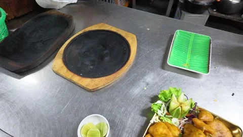 Overhead View of Empty Sizzler Plates in Commercial Kitchen Stock Footage 339122448