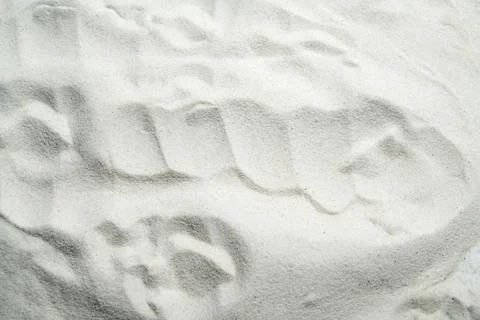 An overhead view of fine white sand showing natural wavy ripple patterns, c.. Stock Photos