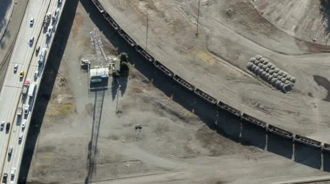 Overhead View of Freight Train Passing Through Industrial Area Stock Footage 25363069