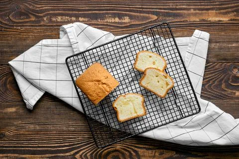 Overhead view of fresh biscuit cake with apple on wooden table 스톡 사진