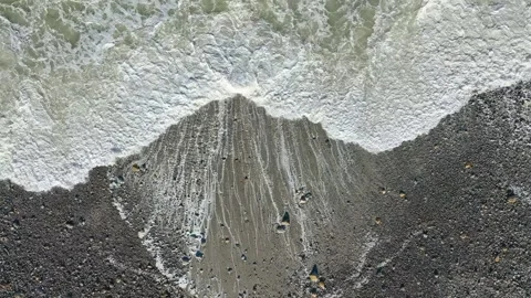Overhead View Of Frothy Ocean Waves Rolling. Aerial Topdown Shot Stock Footage 255719753