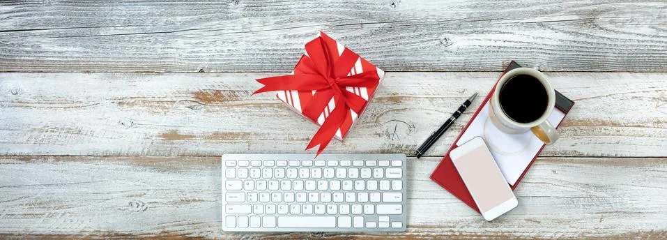 Overhead view of a functional desktop during holiday season with coffee 库存照片