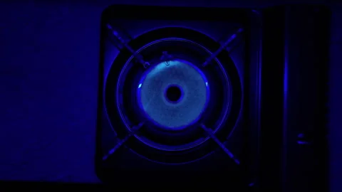 Overhead View of Gas Burner Ignition and Heating in Darkness 스톡 동영상 322774403
