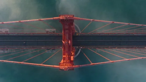 Overhead view of Golden Gate Bridge, San Francisco in misty golden sunset light Stock Footage 255351431