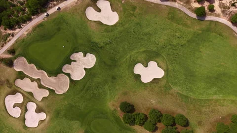 Overhead view of a golf course fairway with multiple sand bunkers, manicured Stock Footage 336785343