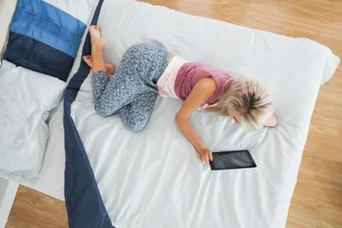 Overhead view of gorgeous blonde using tablet Foto stock