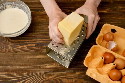 Overhead view of grating cheese Stock-Fotos