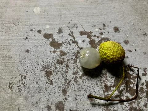 Overhead view of green lychee on a rustic background.Ready to eat lychee. Stock Photos