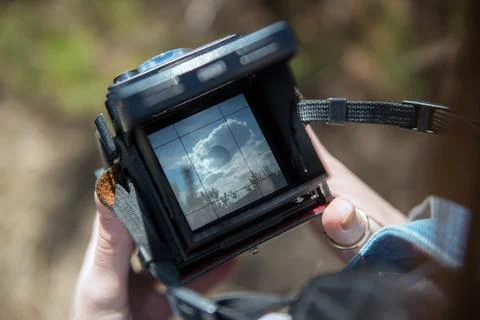 An overhead view of hands holding a medium format retro film camera. Close-up Stock Photos