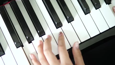 Overhead View of Hands Playing Piano Keys Stock Footage 308075112