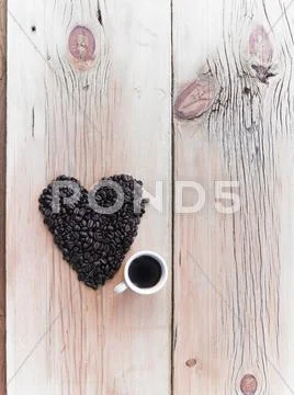 Overhead View Of A Heap Of Roasted Organic Coffee Beans In A Heart Shape, Arr