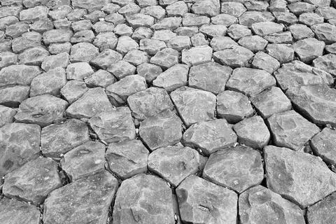 Overhead view of hexagonal stone formations creating a natural geometric patt Stock Photos