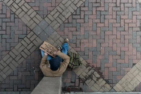 Overhead view of a homeless panhandler Stock Photos