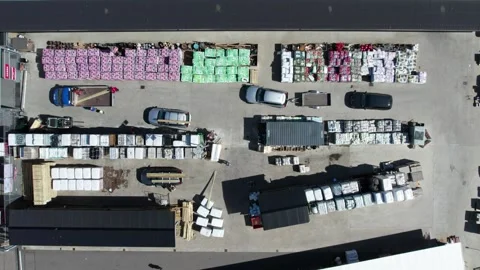 Overhead View of Jem and Fix Hardware Store with Cars at Outdoor Loading Area Stock Footage 345248315