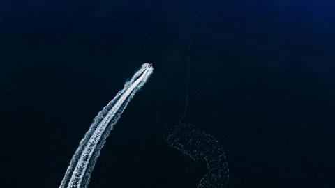 Overhead view of a jet ski leaving wake patterns on the sea, Bulgaria Stock Footage 339670786