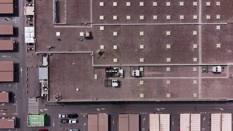 Overhead view of a large flat commercial rooftop with symmetrical skylight Stock Footage 341303599