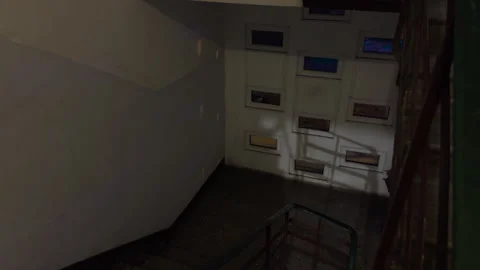 Overhead view of lit staircase with shadowing effects highlighting urban Stock Footage 328377572