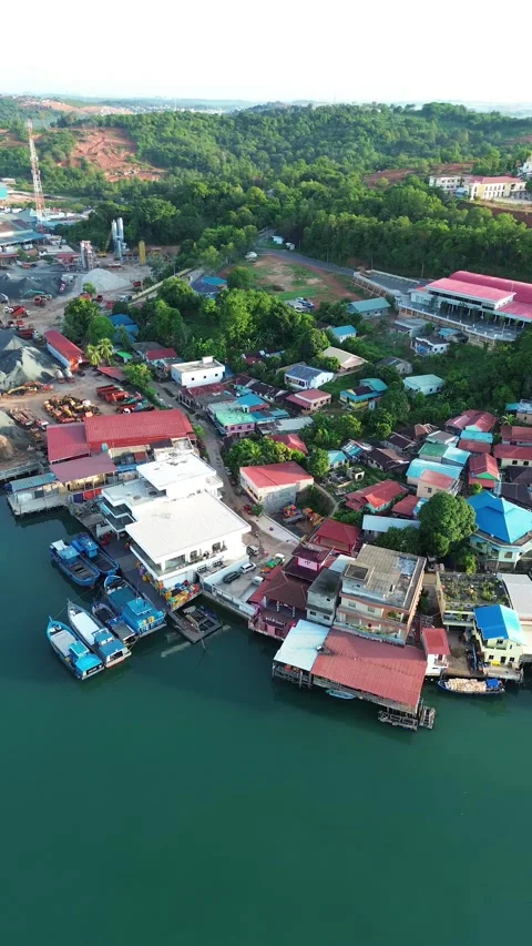 Overhead view of a lively tropical estuary community, where colorful homes .. Stock-Footage 337283089